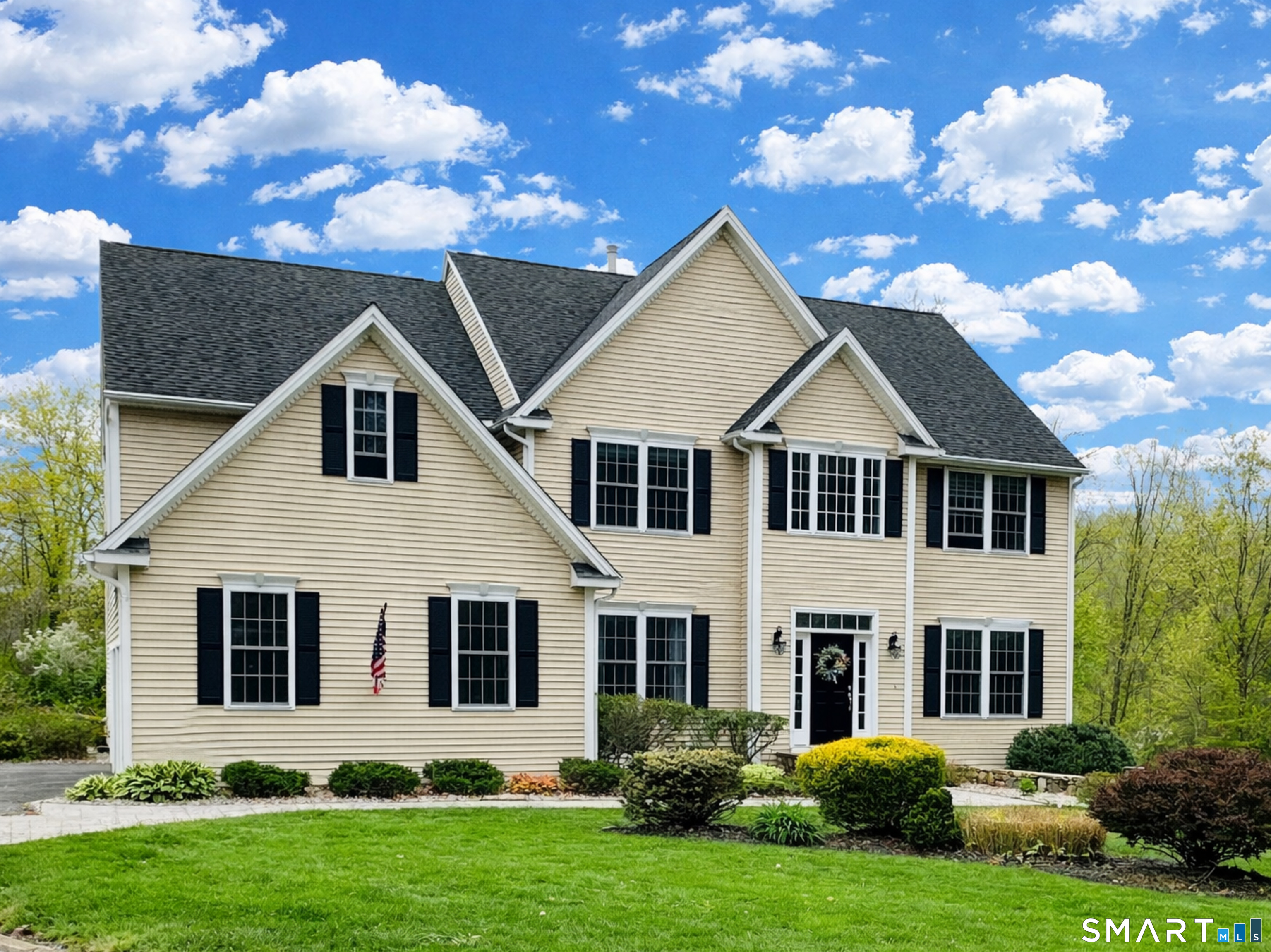 22 R Olde Yankee Way Durham, CT 06422 - Photo 2 of 29 Classic Colonial curb appeal that instantly feels like home. Elegant upper windows, striking gables, and beautifully maintained landscaping create a warm, inviting first impression that sets the tone for everything inside.