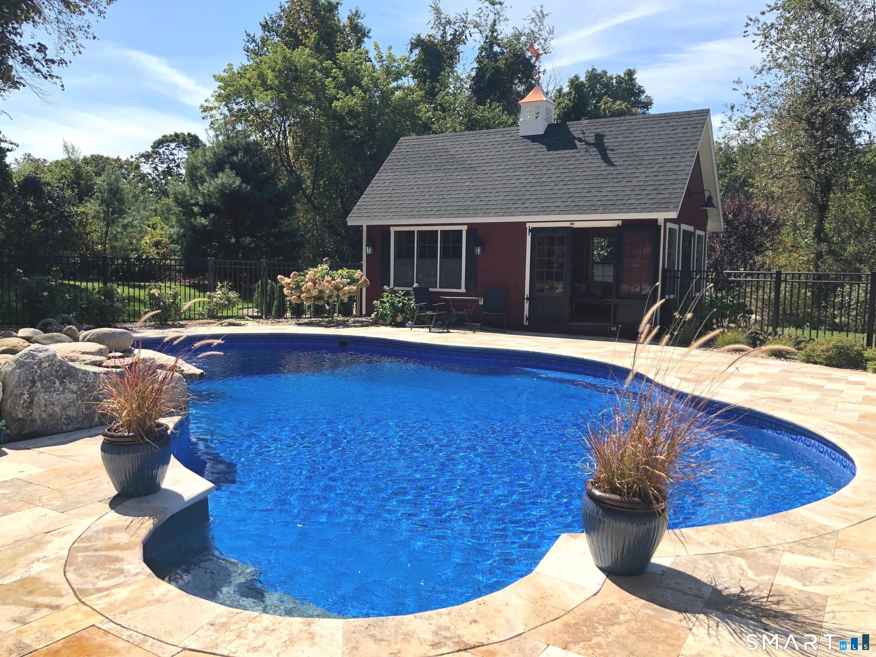 22 R Olde Yankee Way Durham, CT 06422 - Photo 3 of 29 Beautiful backyard retreat featuring inground pool, expansive stone patio, and charming pool house - ideal for outdoor entertaining.