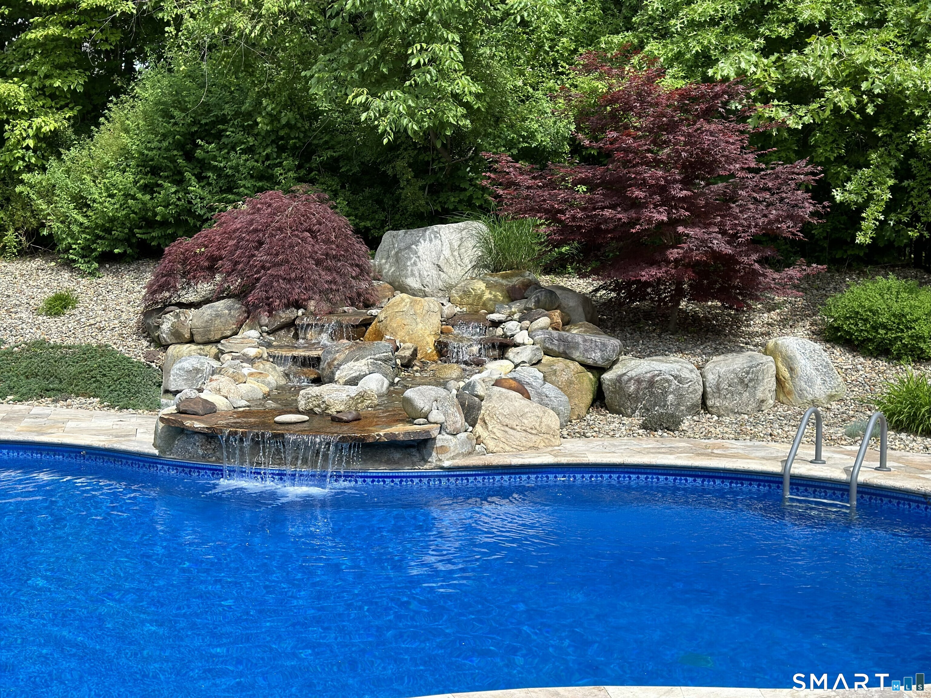 22 R Olde Yankee Way Durham, CT 06422 - Photo 4 of 29 Resort-style inground pool with tranquil waterfall feature and elegant travertine surround.