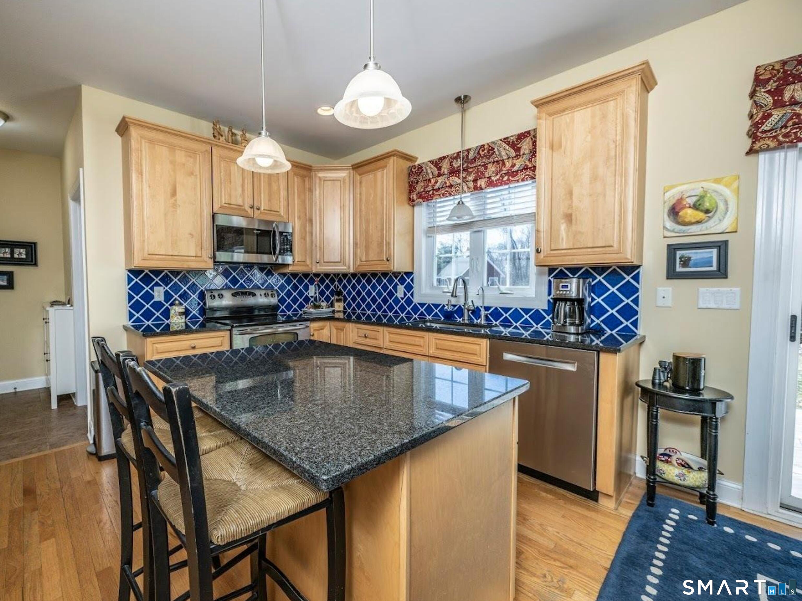 22 R Olde Yankee Way Durham, CT 06422 - Photo 8 of 29 Bright kitchen with granite island seating, stainless appliances, and abundant cabinetry - ideal for everyday living and entertaining.