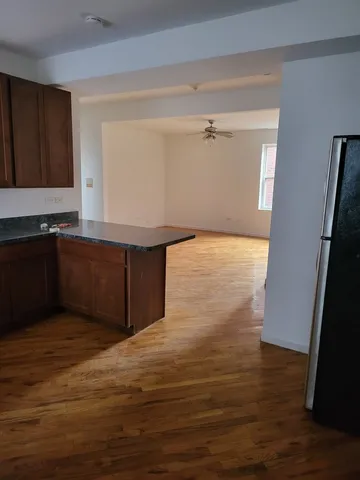 a view of kitchen with wooden floor