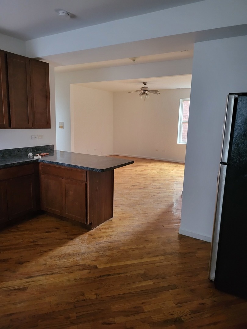 820 East 44th Street, Unit 2 Chicago, IL 60653 - Photo 6 of 12 a view of kitchen with wooden floor