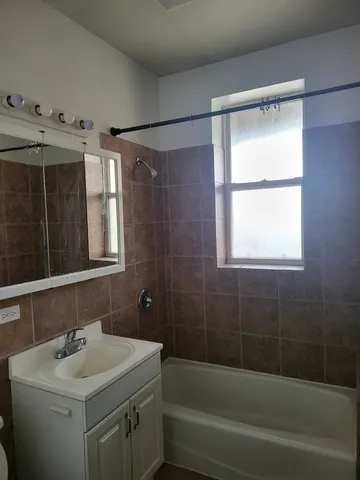 a bathroom with a sink and a bathtub
