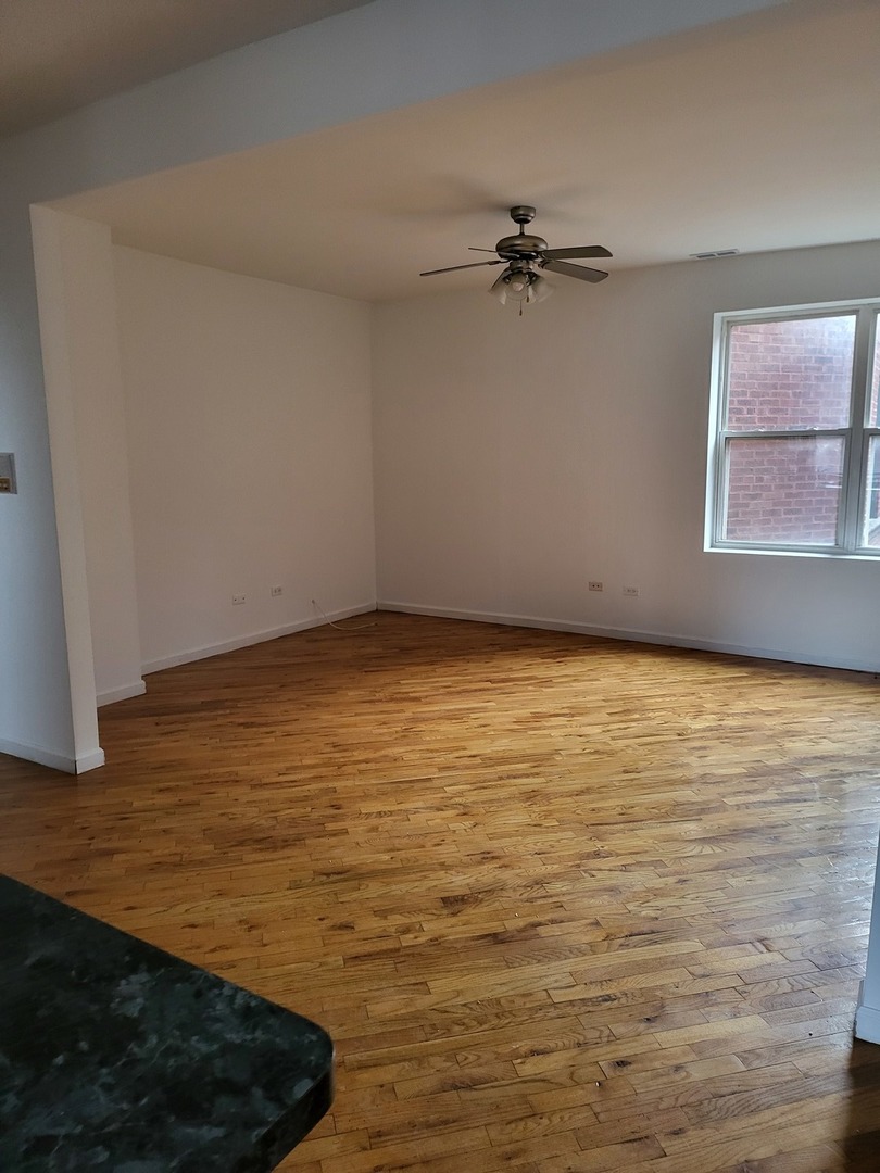 820 East 44th Street, Unit 2 Chicago, IL 60653 - Photo 10 of 12 a view of a room with an empty space and a window