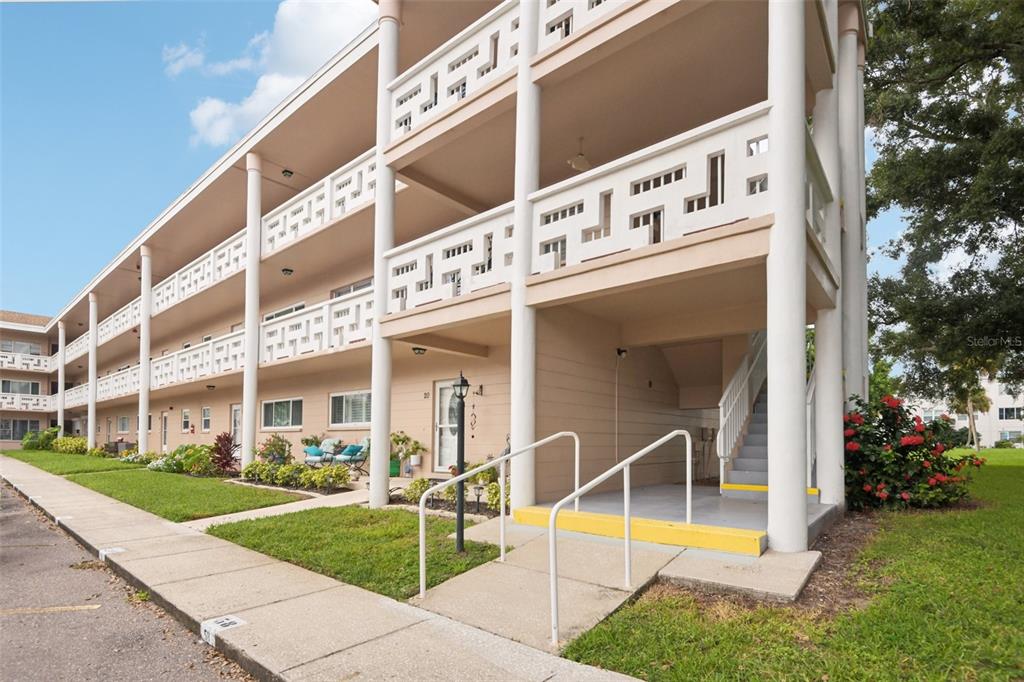 2436 Rhodesian Drive, Unit 20 Clearwater, FL 33763 - Photo 1 of 1 a view of a building with a yard