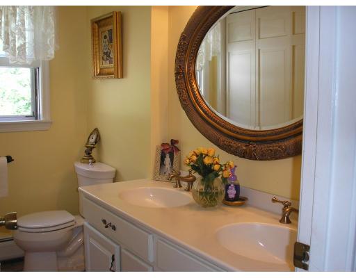 7 Stuart Place Westfield, MA 01085 - Photo 11 of 20 a bathroom with a sink mirror vanity and toilet