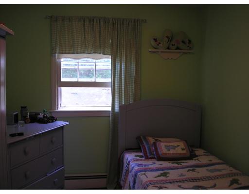 7 Stuart Place Westfield, MA 01085 - Photo 14 of 20 a bedroom with a bed and window