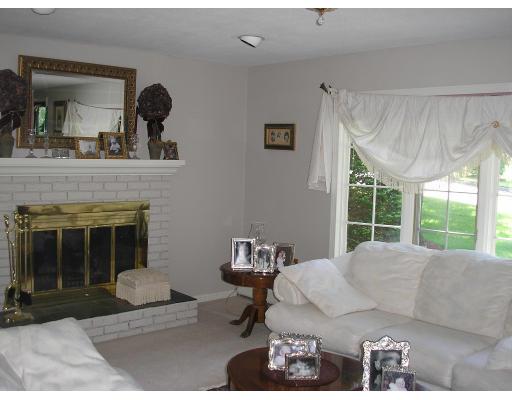 7 Stuart Place Westfield, MA 01085 - Photo 2 of 20 a living room with furniture and a fireplace