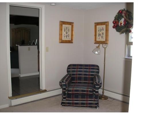 7 Stuart Place Westfield, MA 01085 - Photo 5 of 20 a view of a hallway with stairs and a dresser with couch