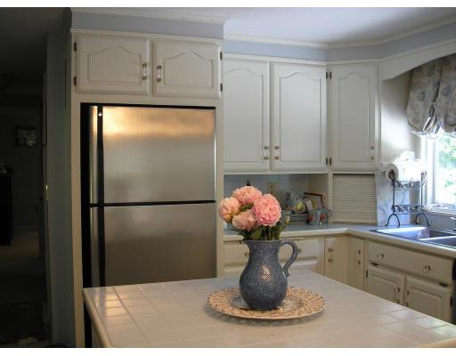 7 Stuart Place Westfield, MA 01085 - Photo 10 of 20 a kitchen with a sink and refrigerator