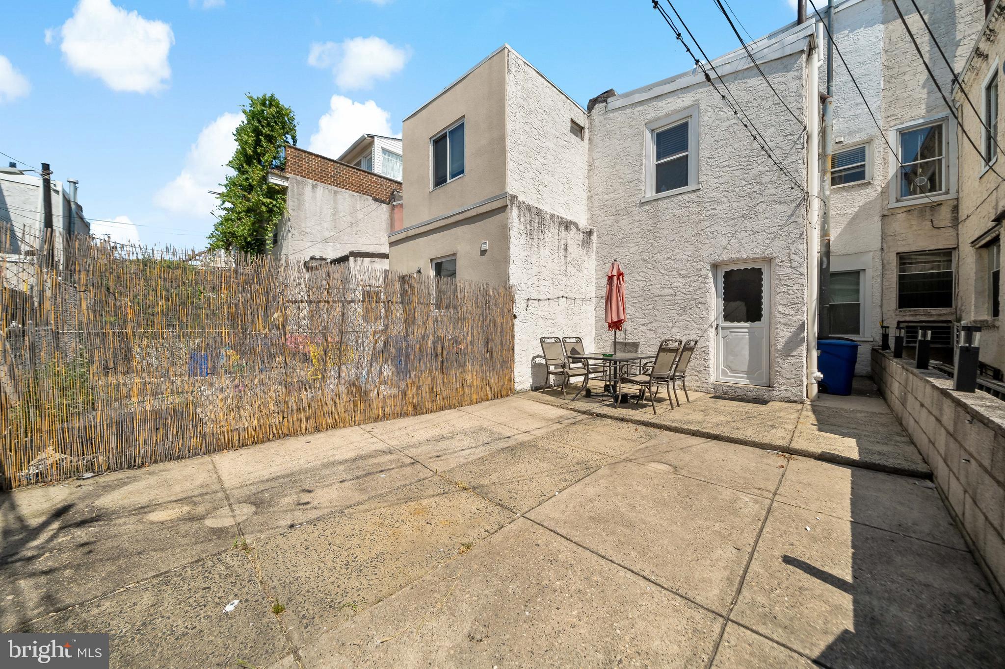 1304 Jackson Street, Unit 1 Philadelphia, PA 19148 - Photo 5 of 16 a view of a house with a backyard
