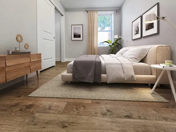 a bedroom with a bed and window