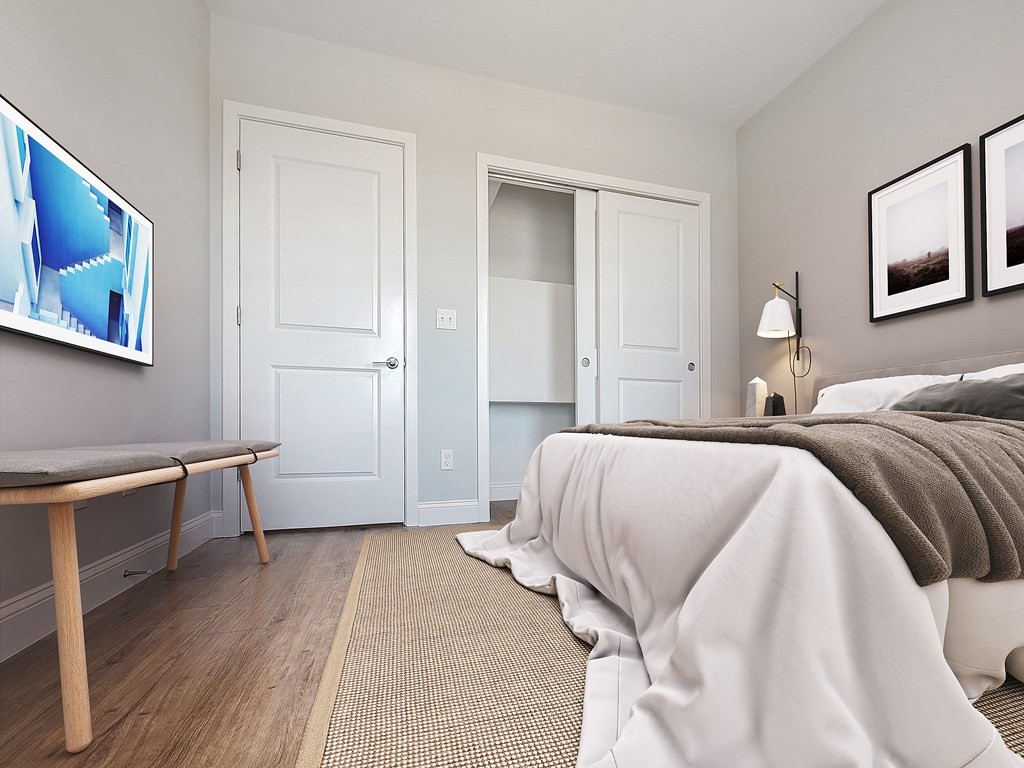334-336 Warren Street, Unit 4 Boston, MA 02119 - Photo 8 of 10 a spacious bedroom with a bed and a desk