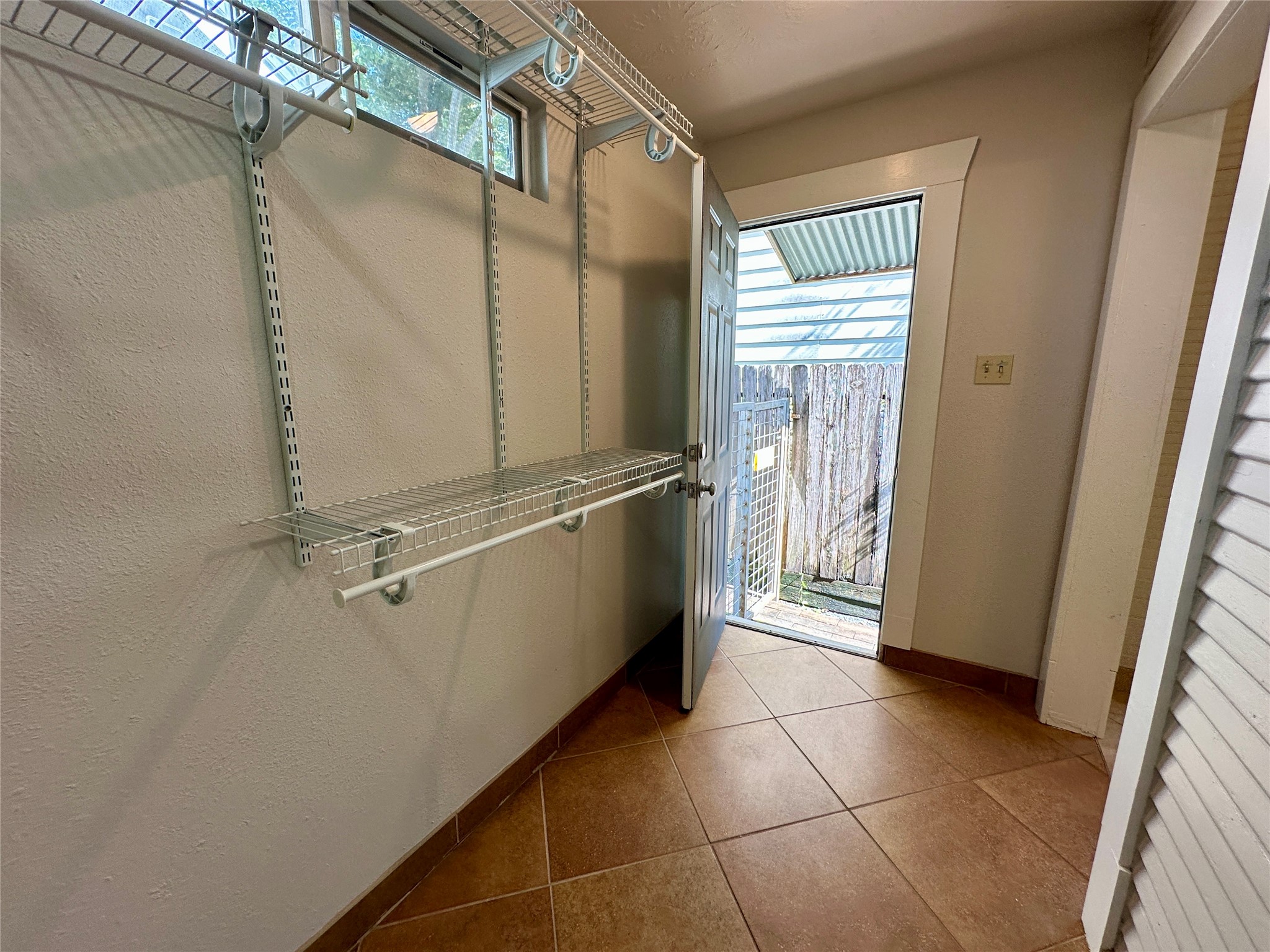 405 James, Unit 2 Houston, TX 77009 - Photo 11 of 12 a bathroom with a granite countertop sink a toilet and a mirror