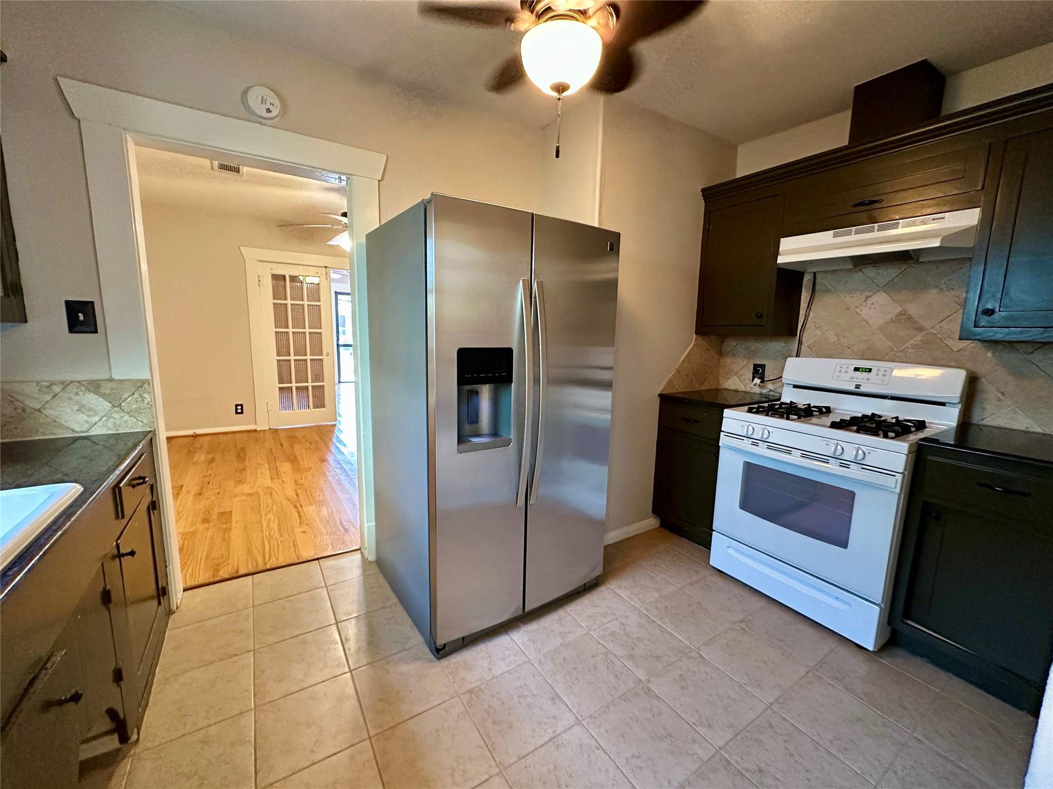 405 James, Unit 2 Houston, TX 77009 - Photo 8 of 12 a kitchen with stainless steel appliances granite countertop a refrigerator and a stove