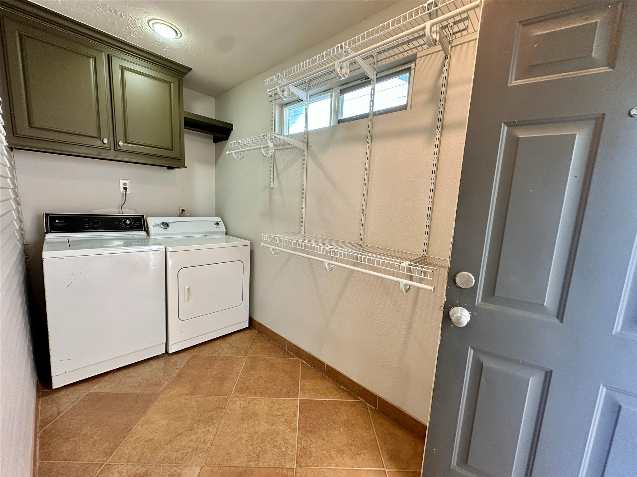 405 James, Unit 2 Houston, TX 77009 - Photo 10 of 12 a utility room with sink dryer and washer