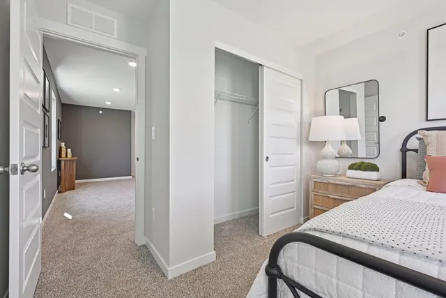 a bedroom with a bed and a view of bathroom