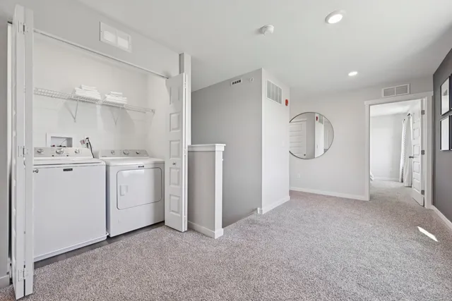a view of a storage & utility room with closet window