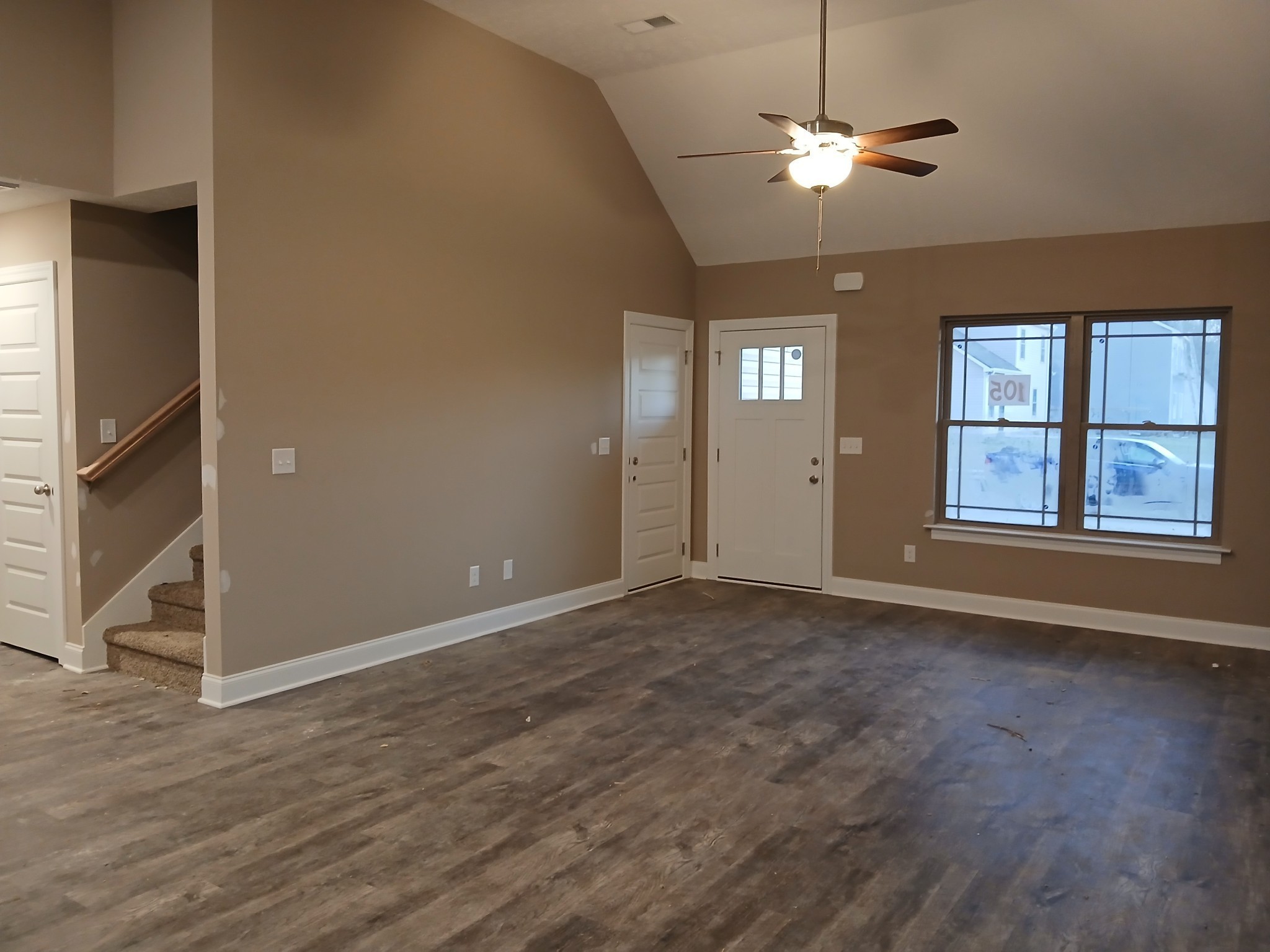 2859 Upstream Road Christiana, TN 37037 - Photo 12 of 72 a view of an empty room with a window and wooden floor