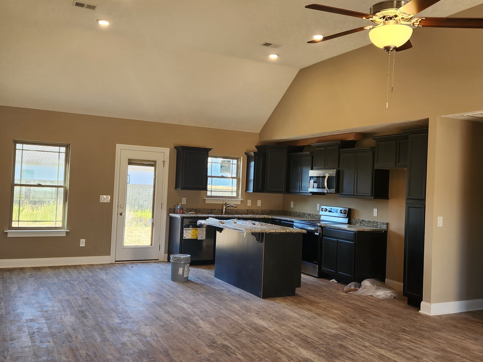 2859 Upstream Road Christiana, TN 37037 - Photo 27 of 72 a kitchen with stainless steel appliances granite countertop a sink dishwasher stove and oven with wooden floor