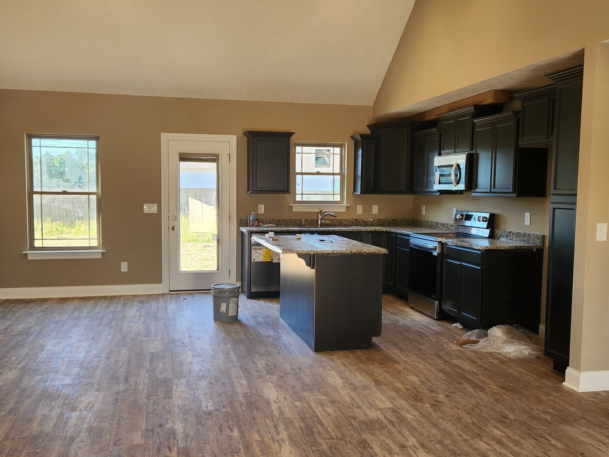 2859 Upstream Road Christiana, TN 37037 - Photo 31 of 72 a kitchen with stainless steel appliances granite countertop a sink and a stove top oven