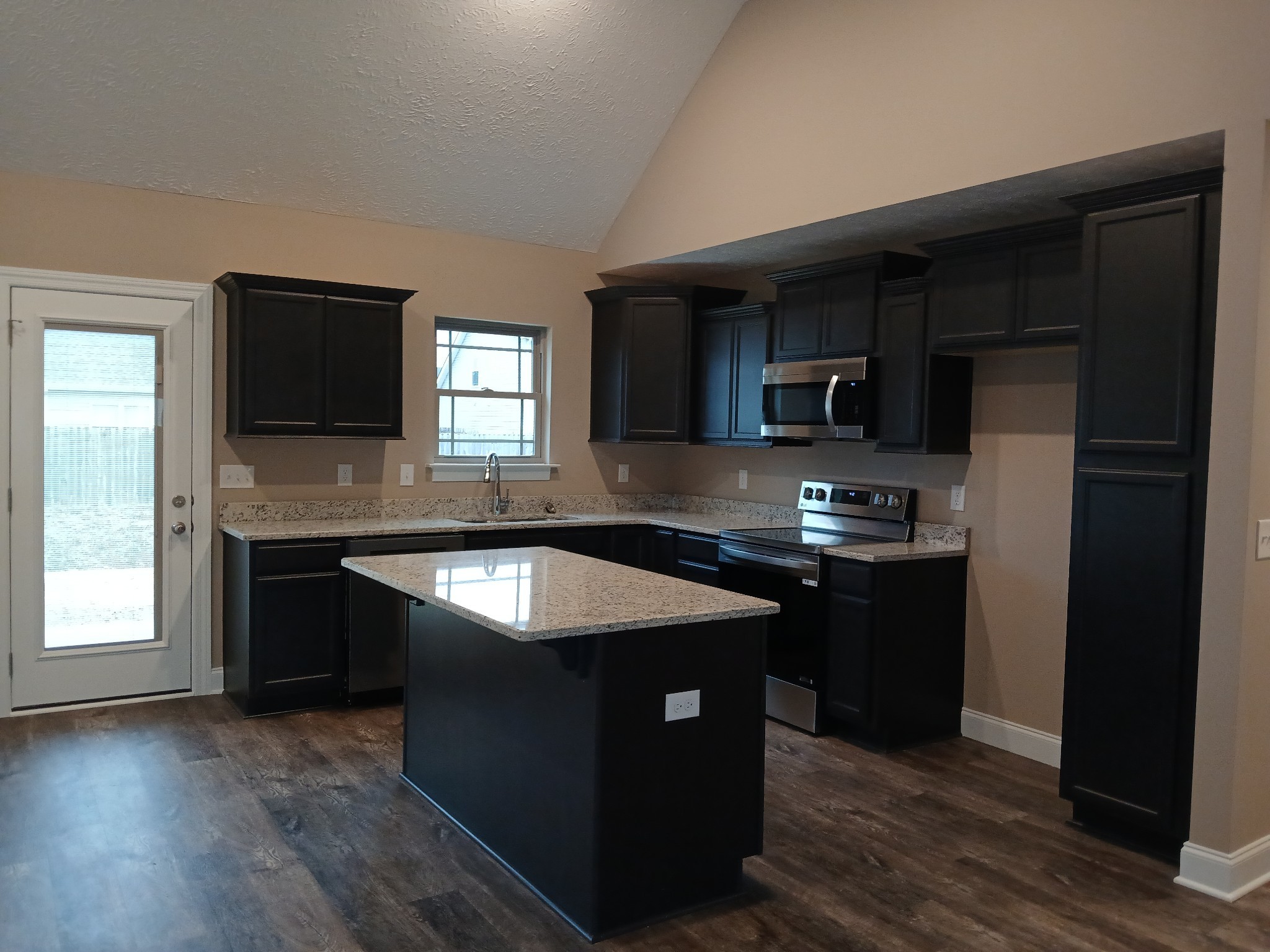 2859 Upstream Road Christiana, TN 37037 - Photo 5 of 72 a kitchen with stainless steel appliances granite countertop a sink stove and refrigerator