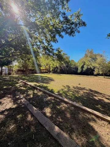 a view of a large body of water with a building in the background