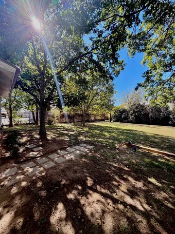 a view of outdoor space with deck and yard