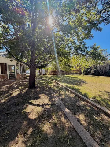 a view of a yard with an outdoor space