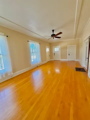 a view of an empty room with a window