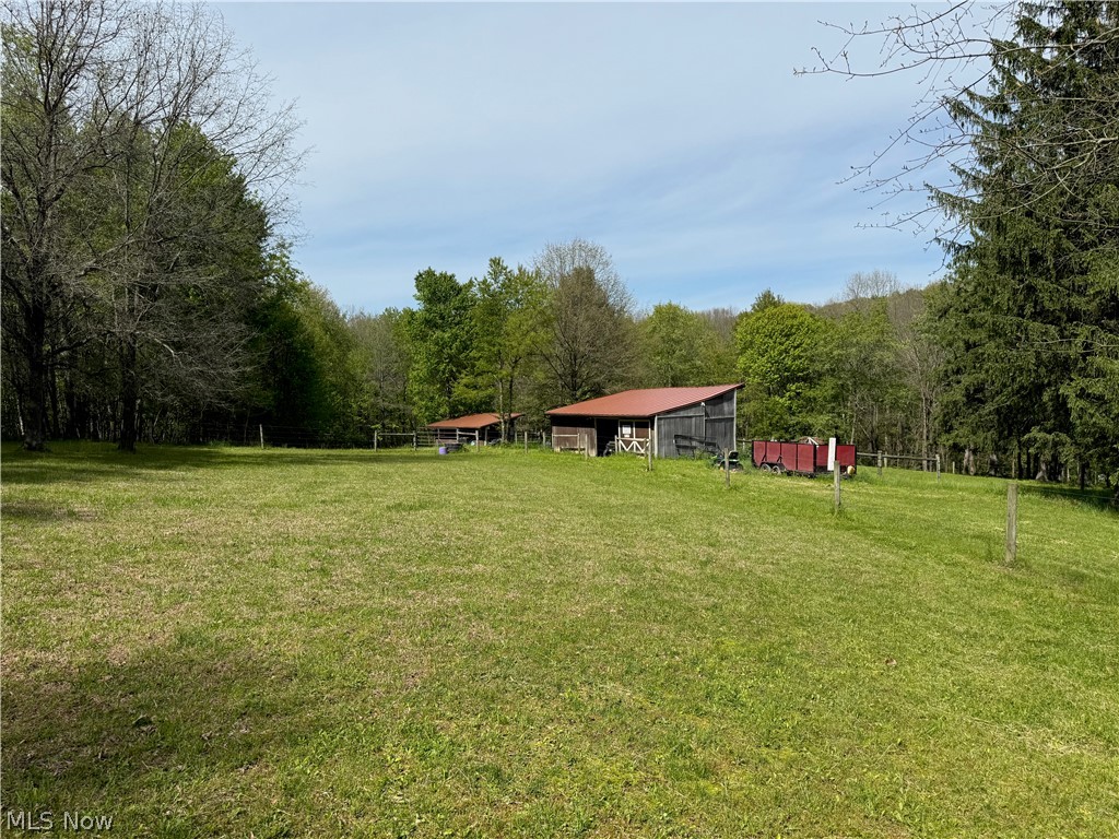 11811 Gaston Road Rogers, OH 44455 - Photo 23 of 38 You've got several acres of usable space, pole barns, and a Quonset Hut (currently used for recreation). Take advantage of the room to play, and play!!