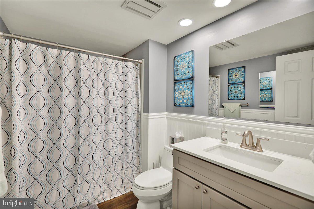 9 A Fairway Road Reading, PA 19607 - Photo 11 of 22 a bathroom with a granite countertop sink and a mirror