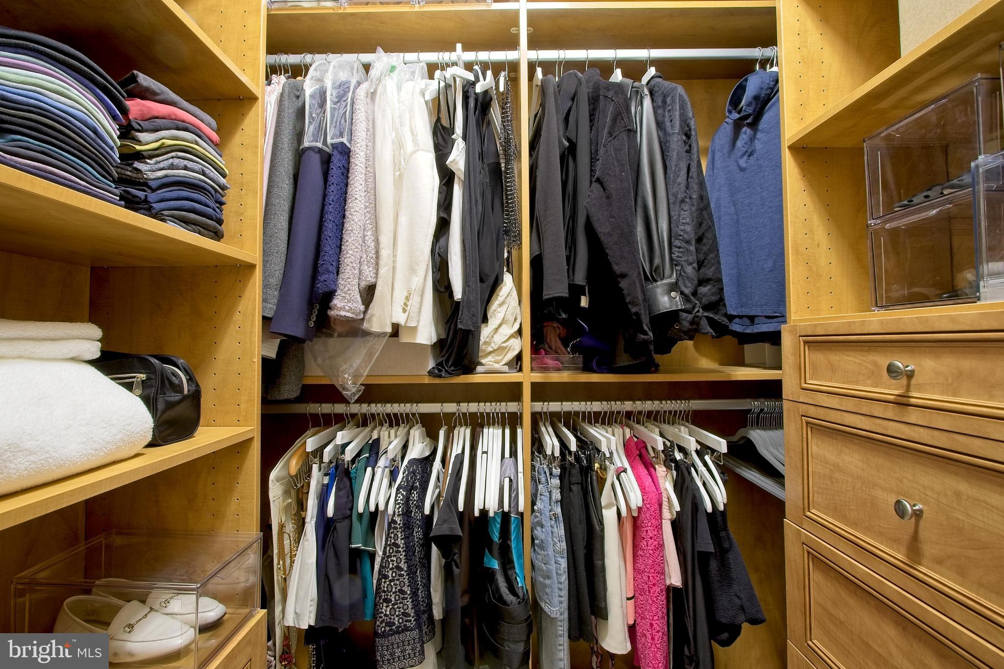 11990 Market Street, Unit 1403 Reston, VA 20190 - Photo 23 of 59 Shelving and drawers behind closet door