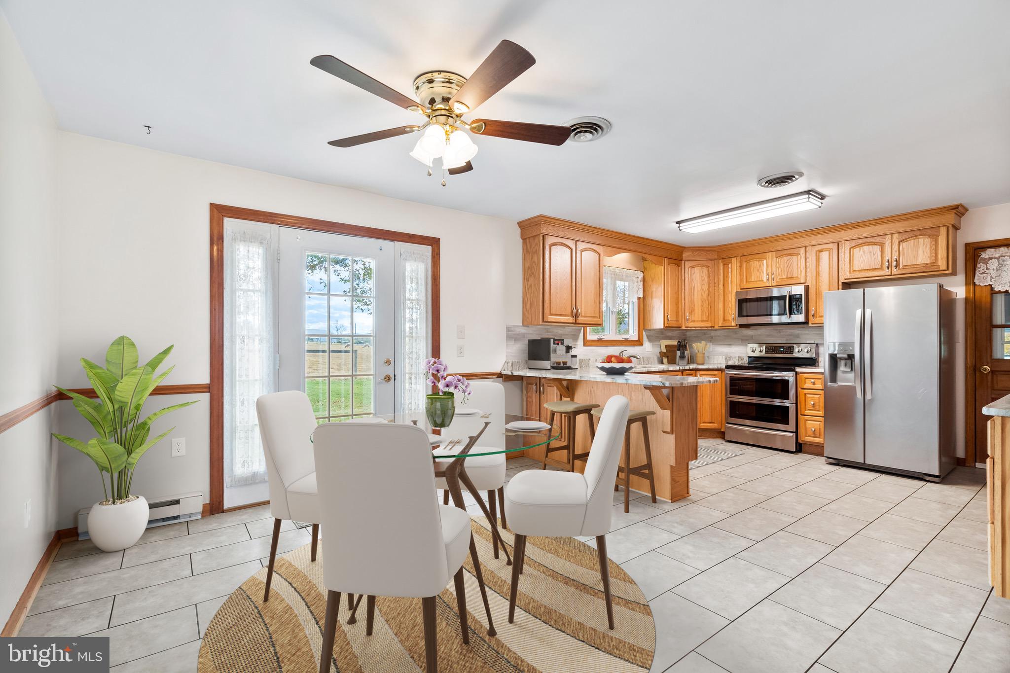 7429 Lewistown Road Thurmont, MD 21788 - Photo 11 of 68 a view of a dining room with furniture window and outside view