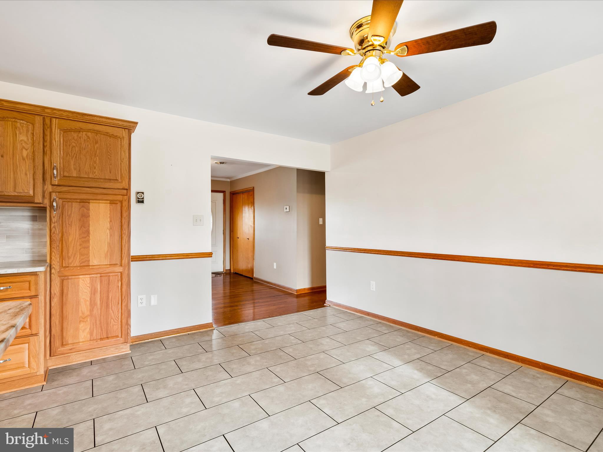7429 Lewistown Road Thurmont, MD 21788 - Photo 22 of 68 a view of an empty room with window and chandelier fan