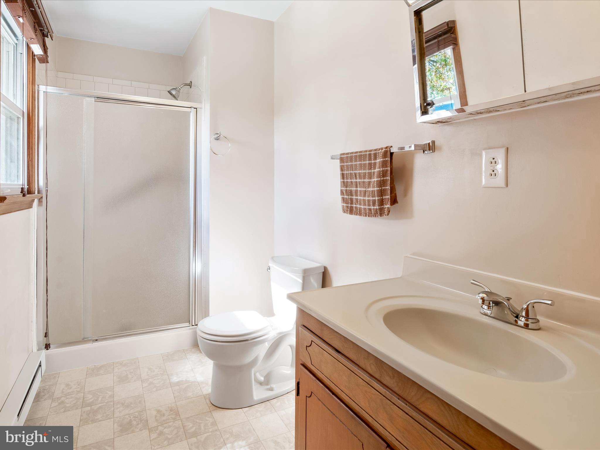 7429 Lewistown Road Thurmont, MD 21788 - Photo 29 of 68 a bathroom with a sink a toilet and a mirror