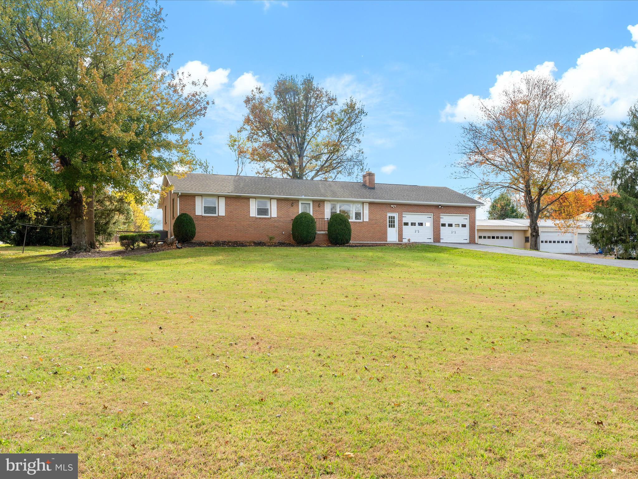7429 Lewistown Road Thurmont, MD 21788 - Photo 3 of 68 a view of a house with a big yard and large trees