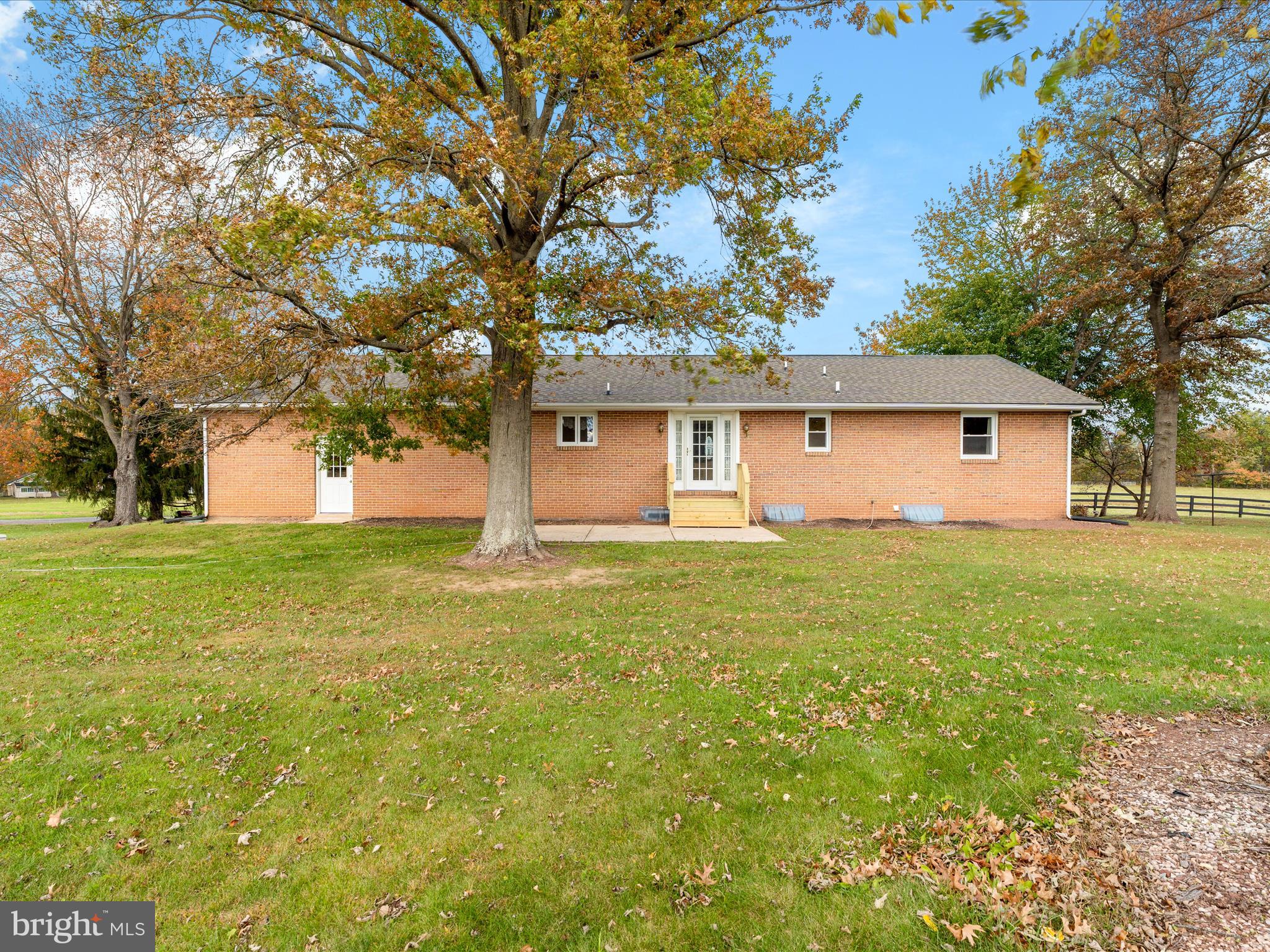 7429 Lewistown Road Thurmont, MD 21788 - Photo 44 of 68 a front view of house with yard and trees around