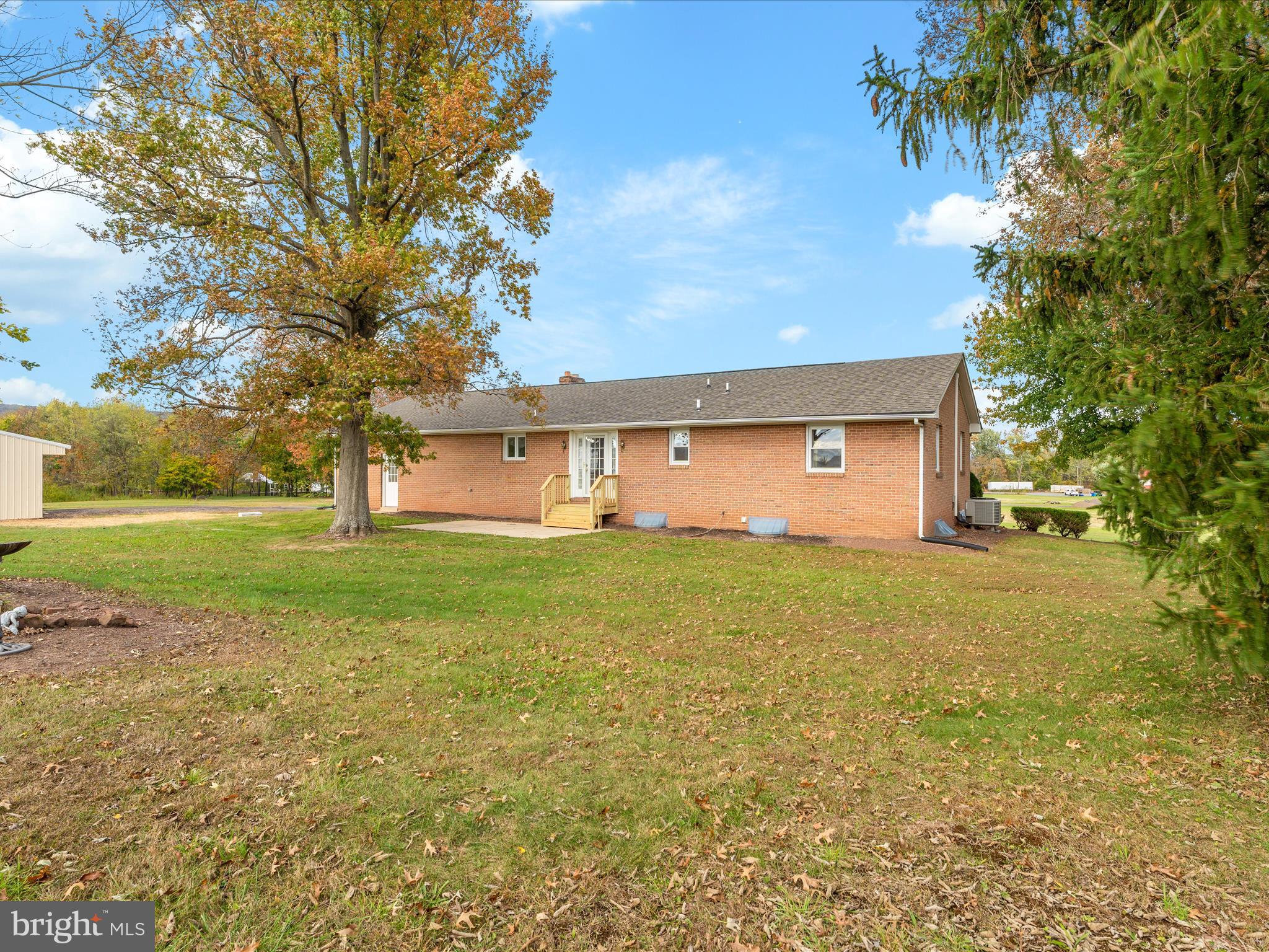 7429 Lewistown Road Thurmont, MD 21788 - Photo 45 of 68 a front view of a house with garden