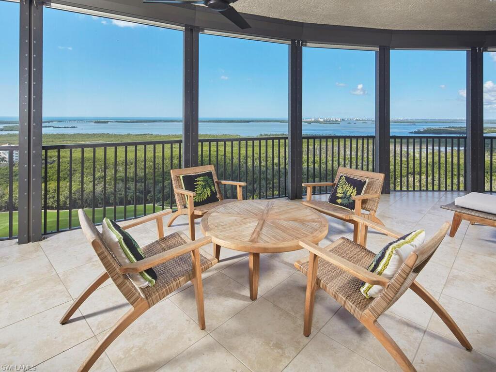 23750 Via Trevi Way, Unit 2001 Estero, FL 34134 - Photo 2 of 26 Sunroom / solarium featuring a water view, floor to ceiling windows, and tile patterned flooring