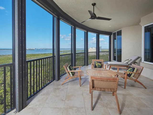 a dining room with furniture window and outside view