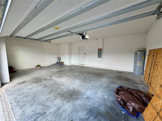 an empty room with large windows