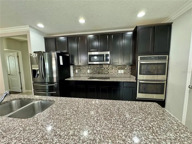 a lobby with furniture and window