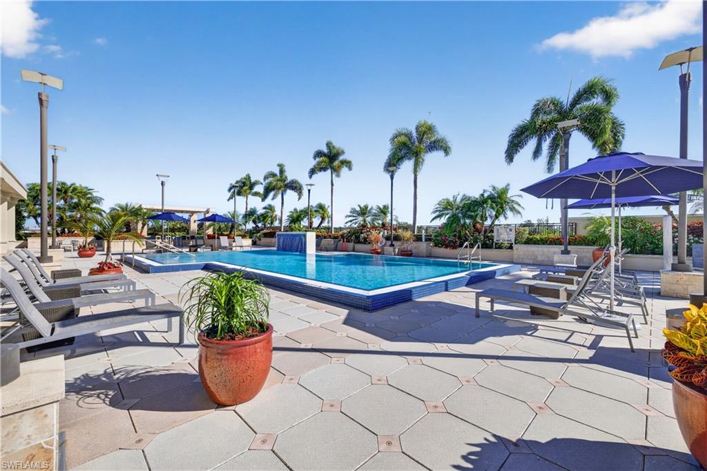 9115 Strada Place, Unit 5504 Naples, FL 34108 - Photo 19 of 22 a view of a backyard with sitting area