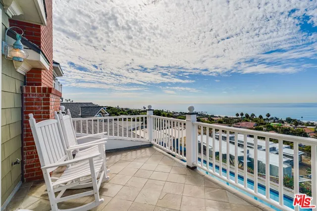 a view of a balcony with an ocean view