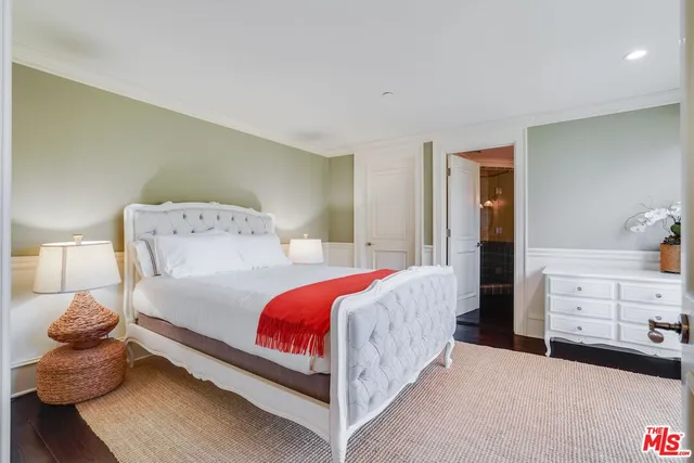 a bedroom with bed and window