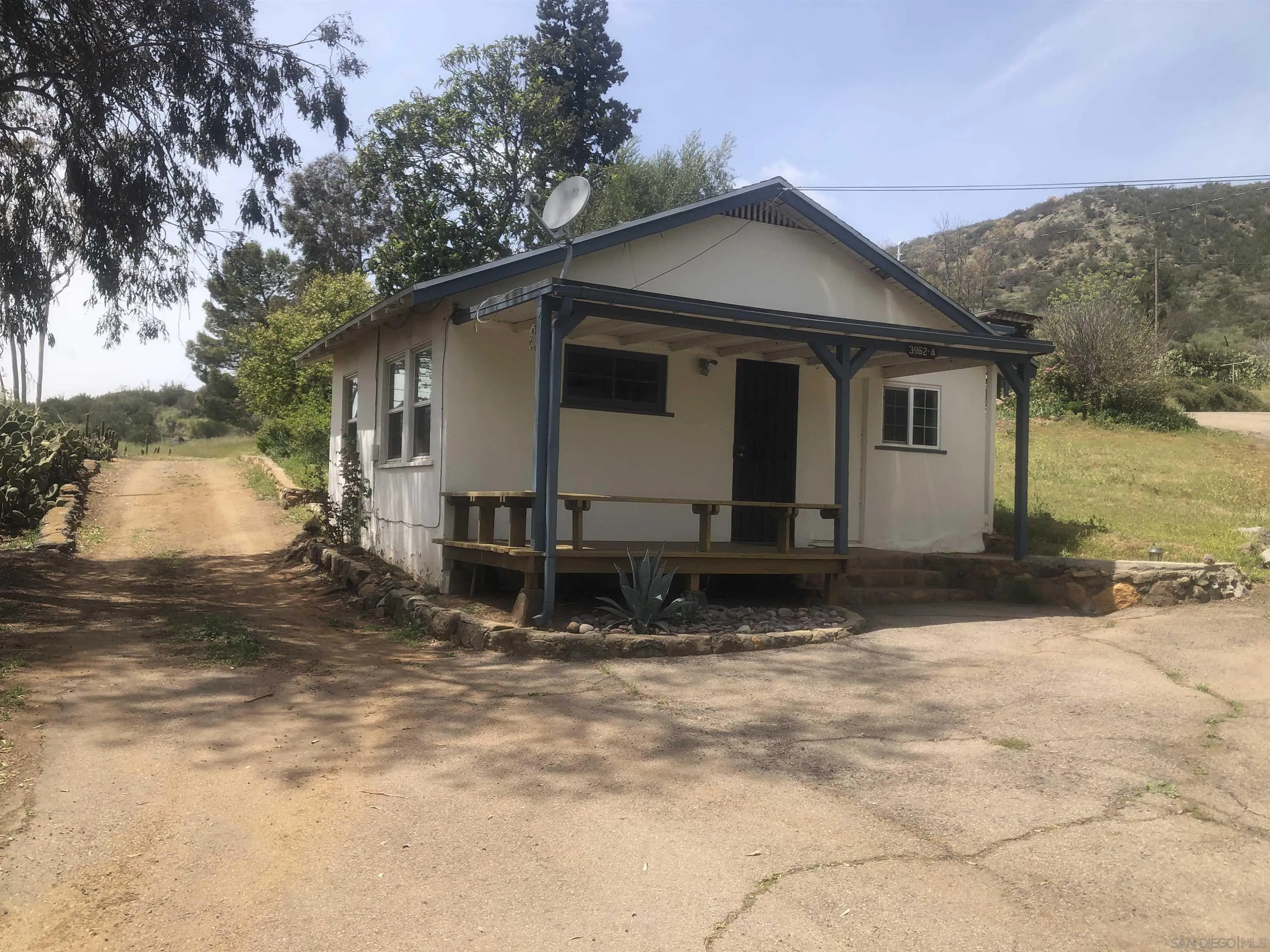 3962 Willows Road Alpine, CA 91901 - Photo 1 of 13 a view of a house with a yard