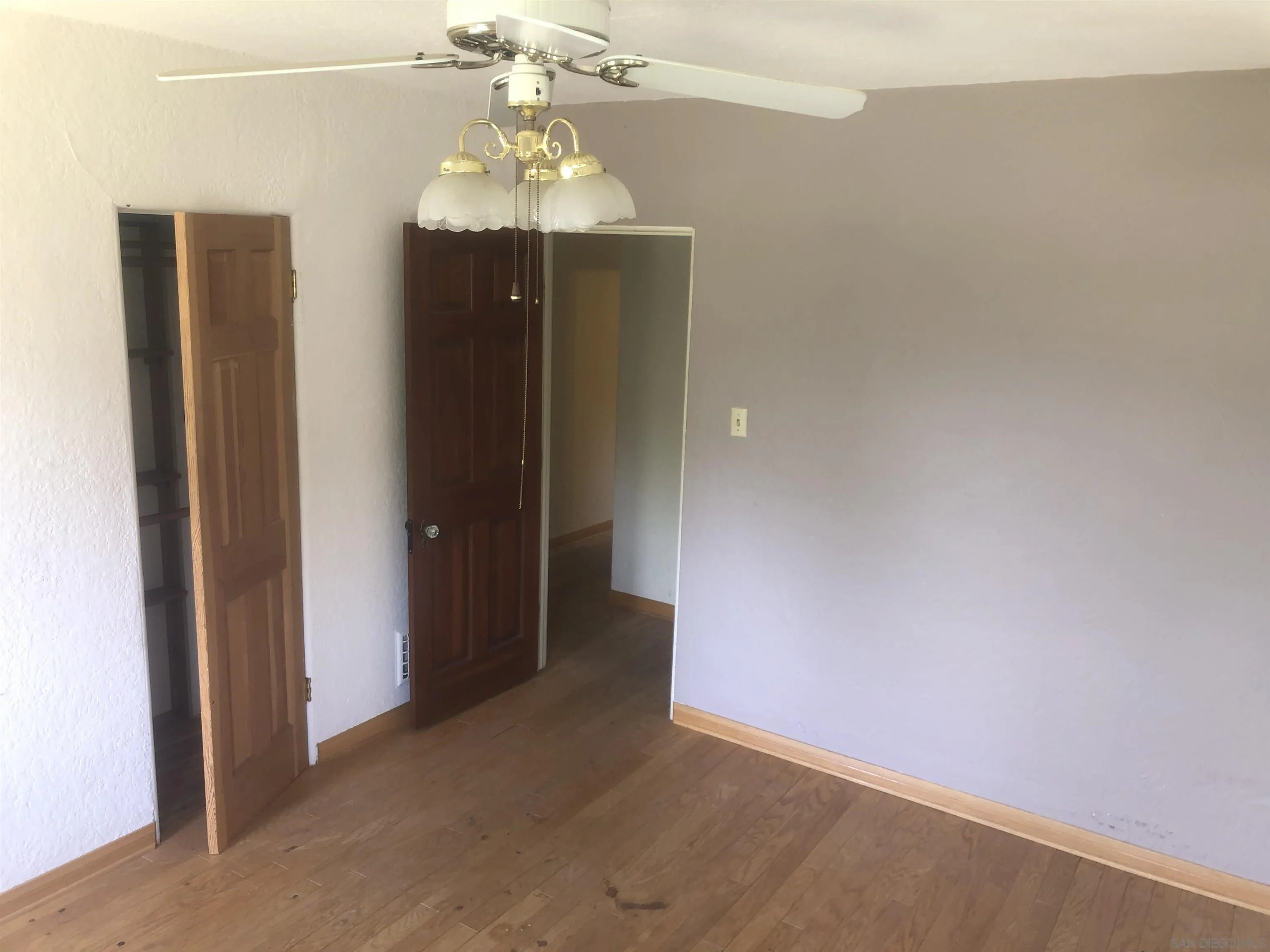 3962 Willows Road Alpine, CA 91901 - Photo 11 of 13 a view of a hallway with a chandelier