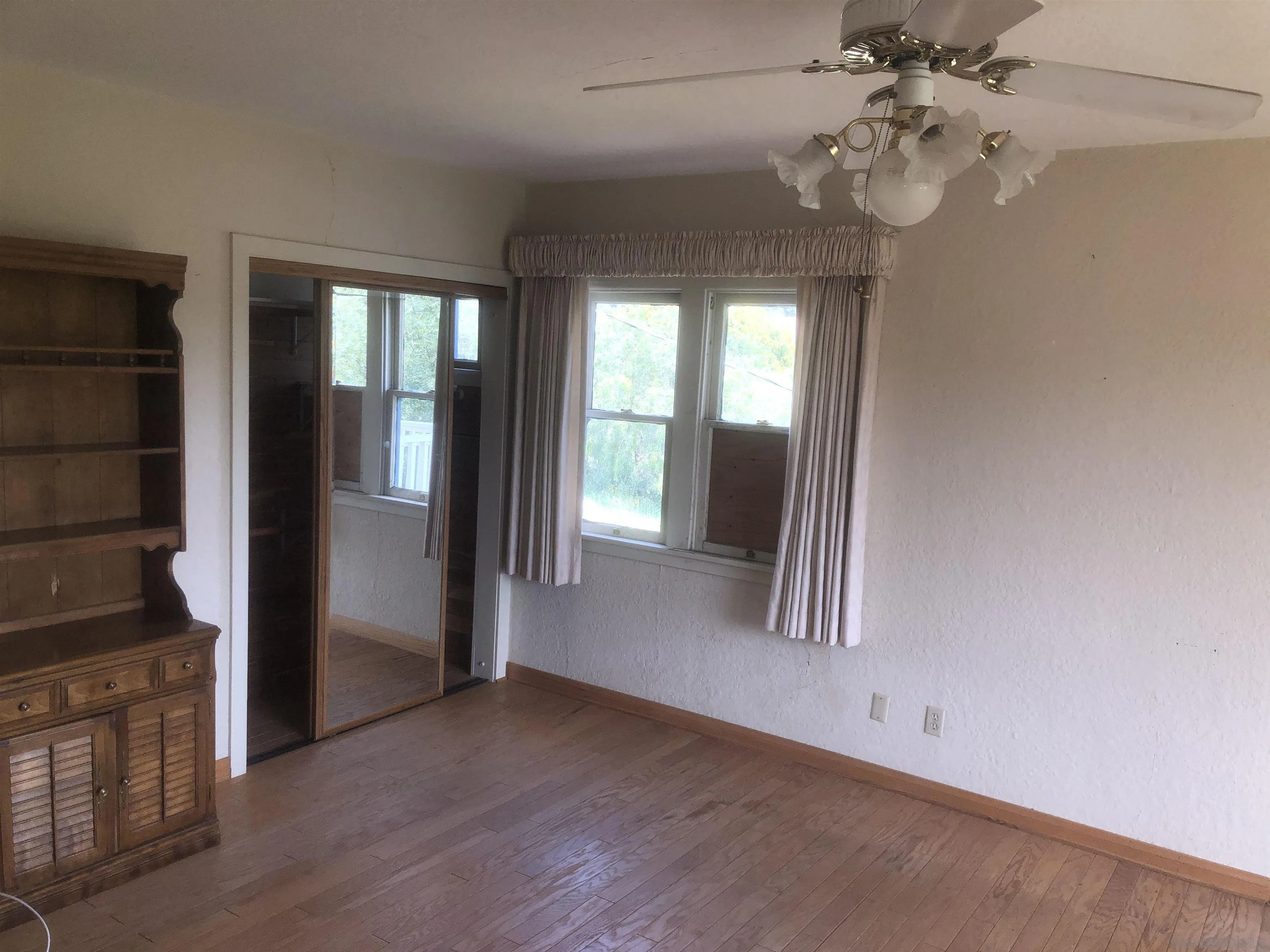 3962 Willows Road Alpine, CA 91901 - Photo 12 of 13 wooden floor in an empty room with a window