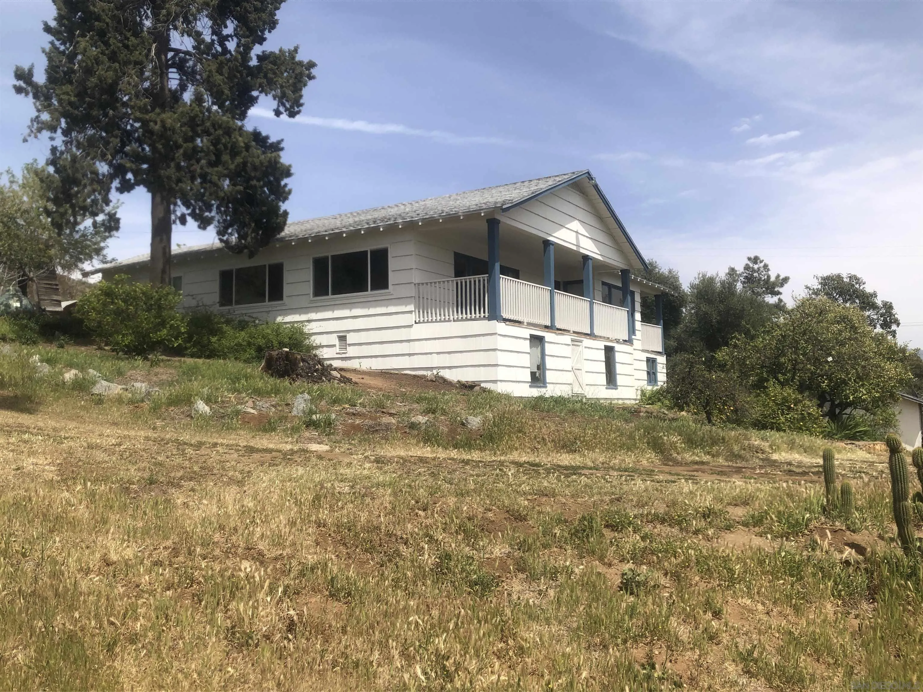 3962 Willows Road Alpine, CA 91901 - Photo 2 of 13 a backyard of a house with table and chairs